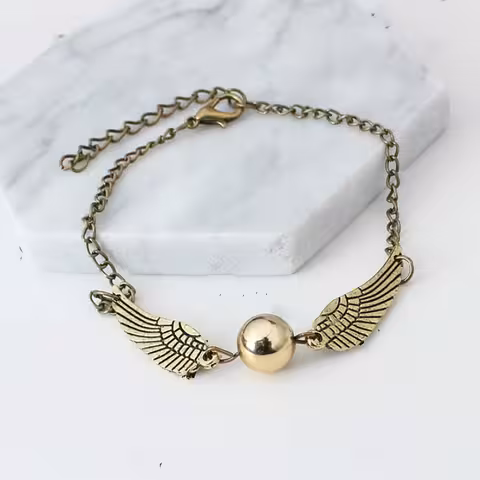 Harry Potter käevõru „Golden Snitch & Deathly Hallows” – kuldne/hõbedane maagiline kingitus fännidele